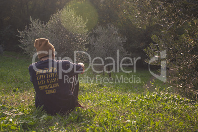 Boy sitting on the grass