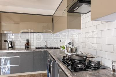 Closeup of luxury modern white, beige and grey kitchen interior