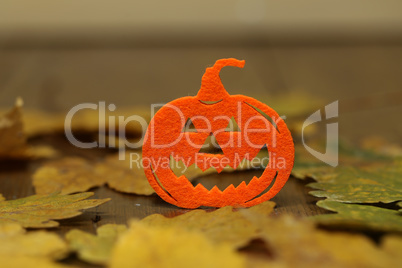 Halloween orange decorative pumpkin on blurry background