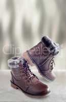 Comfortable winter boots with lacing and zipper closure.