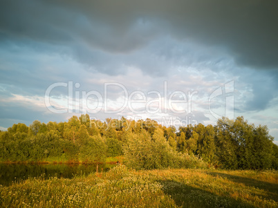 Landscape with a stormy sky at sunset.