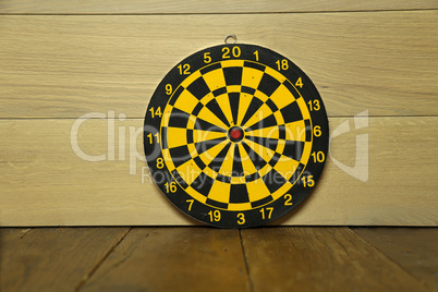 A dart board is standing on the table