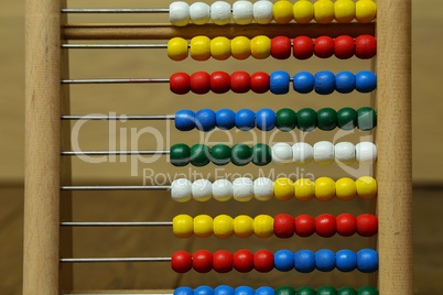 Children's colorful abacus for counting with multi-colored wooden beads
