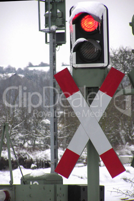 Red traffic lights at the railway crossing