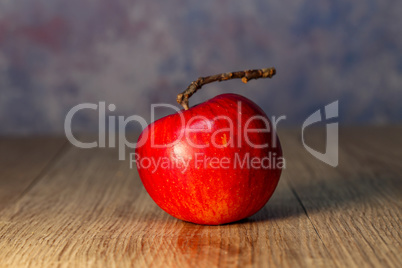 Beautiful red apple lies on the table