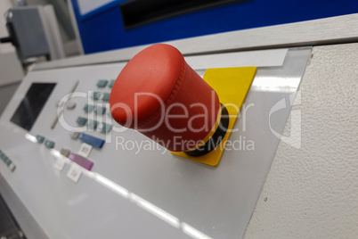 Big red round button on the machine, closeup