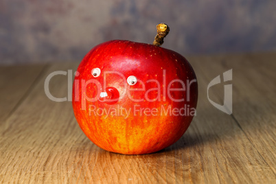 Beautiful red apple lies on the table