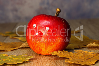 Beautiful red apple lies on the table