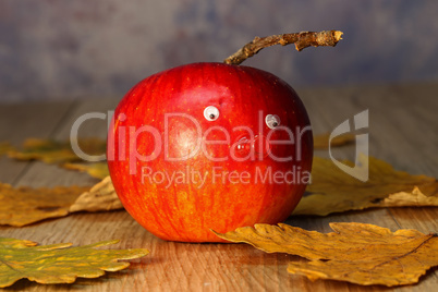 Beautiful red apple lies on the table