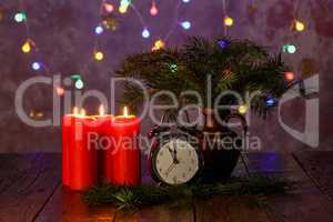 Red Advent candles stand on a wooden table