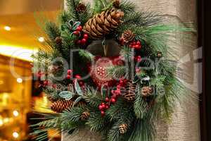 Christmas decoration of spruce twigs, cones and red berries