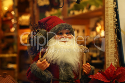Merry Santa Claus in a shop window for Christmas