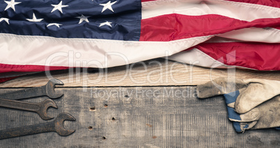 Flag of the USA with tools  on wood