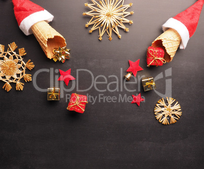Ice cream cones with hat of Santa and gift boxes