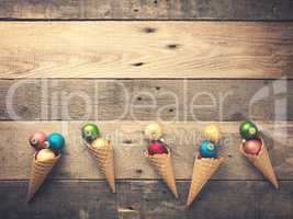 Old used Christmas baubles in an ice cream cone