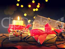 Magical Christmas background with gift boxes and candle