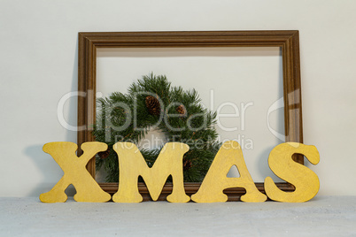 XMAS - Christmas still life with golden letters made of plywood