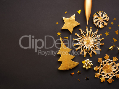 Golden Christmas decoration on a dark background, space for text