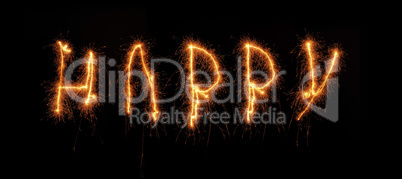 The word HAPPY written with a sparkler