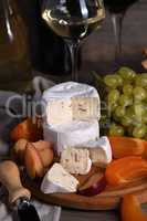 Cheese camembert with fruit and wine