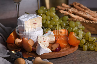 Cheese camembert with fruit and wine