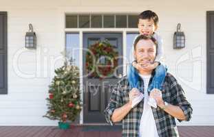 Boy Riding Piggyback on Shoulders of Father On Christmas Decorat