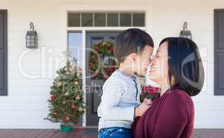 Chinese Mother and Mixed Race Child Rubbing Noses Standing on Ch