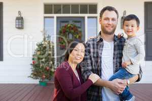 Mixed Race Chinese and Caucasian Parents with Child On Christmas