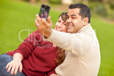 Attractive Mixed Race Couple Taking Self Portraits in the Park