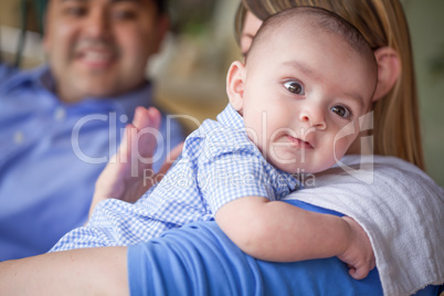 Happy Attractive Mixed Race Couple Burping Their Son