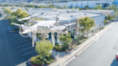 Unmanned Aircraft System Quadcopter Drone In The Air Near Corpor