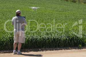 Pilot Flying Unmanned Aircraft Drone Gathering Data Over Country
