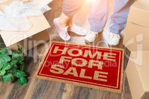 Man and Woman Standing Near Home For Sale Welcome Mat, Moving Bo