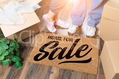 Man and Woman Standing Near Home For Sale Welcome Mat, Moving Bo