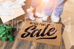 Man and Woman Standing Near Home For Sale Welcome Mat, Moving Bo