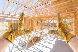 Male Contractor Hands Framing Unfinished House Framing At Constr