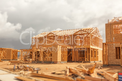 Wood Home Framing Abstract At Construction Site with Stormy Clou
