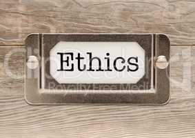 Ethics Metal File Cabinet Label Frame on Wood