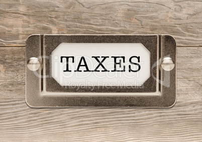 Taxes Metal File Cabinet Label Frame on Wood