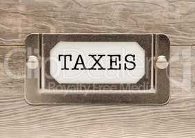 Taxes Metal File Cabinet Label Frame on Wood