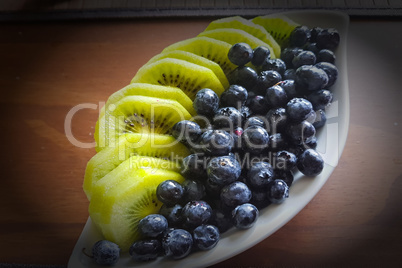 White smoothie bowl with kiwi and blueberry