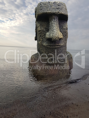 Ancient ruins Mayan head on the beach