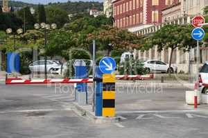 Paid parking with barriers at the entrance and exit