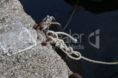 Mooring knot at the port pier. Sealing knot close up