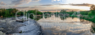 Beautiful view of the dam on the river at sunset