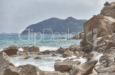 The coast of southern Sardinia with mountains on the sea.