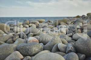 Natural round pebbles on the beach