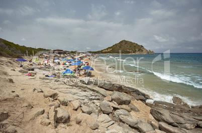 The beach of Monte Turnu with tourists in summer.