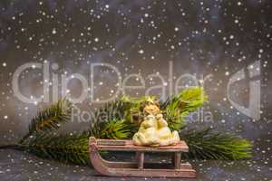 angel on sledge with night sky background