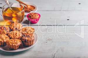 Oatmeal muffins with cup of green tea.
